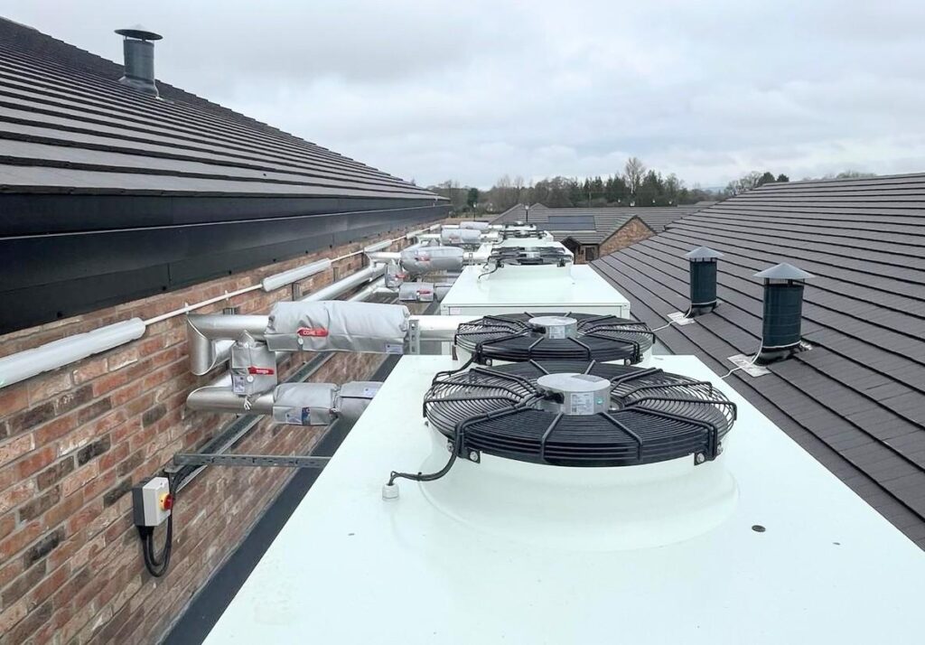 Air source heat pumps on the roof of Provence House, installed by Sayes & Co Ltd